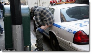 occupy wall street man pooping on police car oct 2011 300x176 The Top 50 Liberal Media Bias Examples