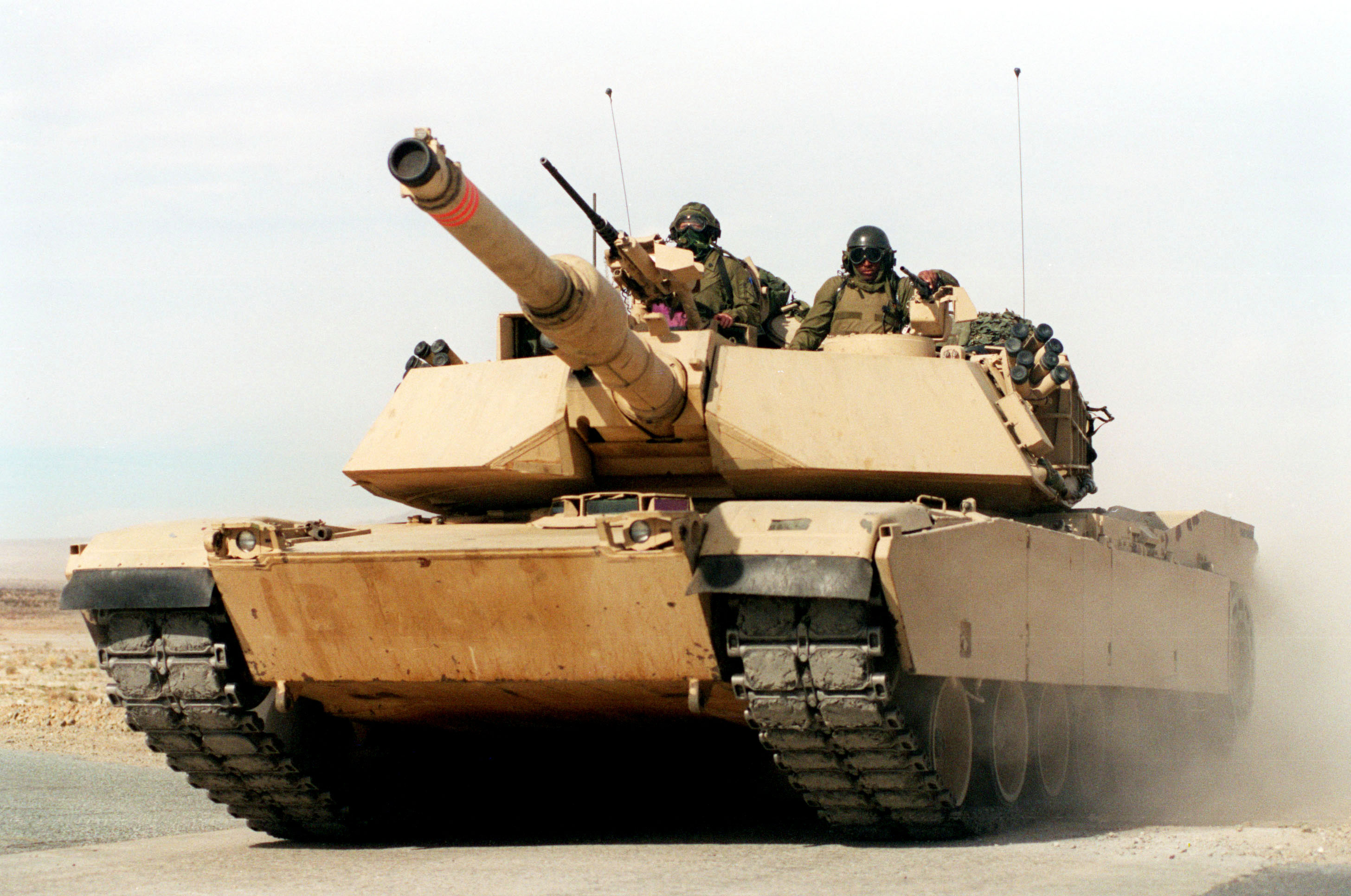 A U.S. Marine Corps M-1A1 Abrams main battle tank races across the desert at the Marine Corps Air Ground Combat Center, Twentynine Palms, Calif., on Jan. 27, 1998. These tankers from the 2nd Tank Battalion are taking part in Combined Arms Exercise 3-98. DoD photo by Lance Cpl. W. Makela, U.S. Marine Corps.