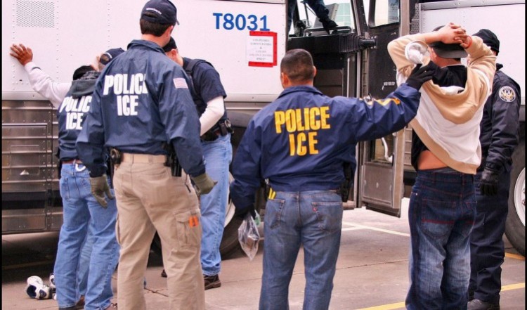 ICE agents arresting an illegal alien.